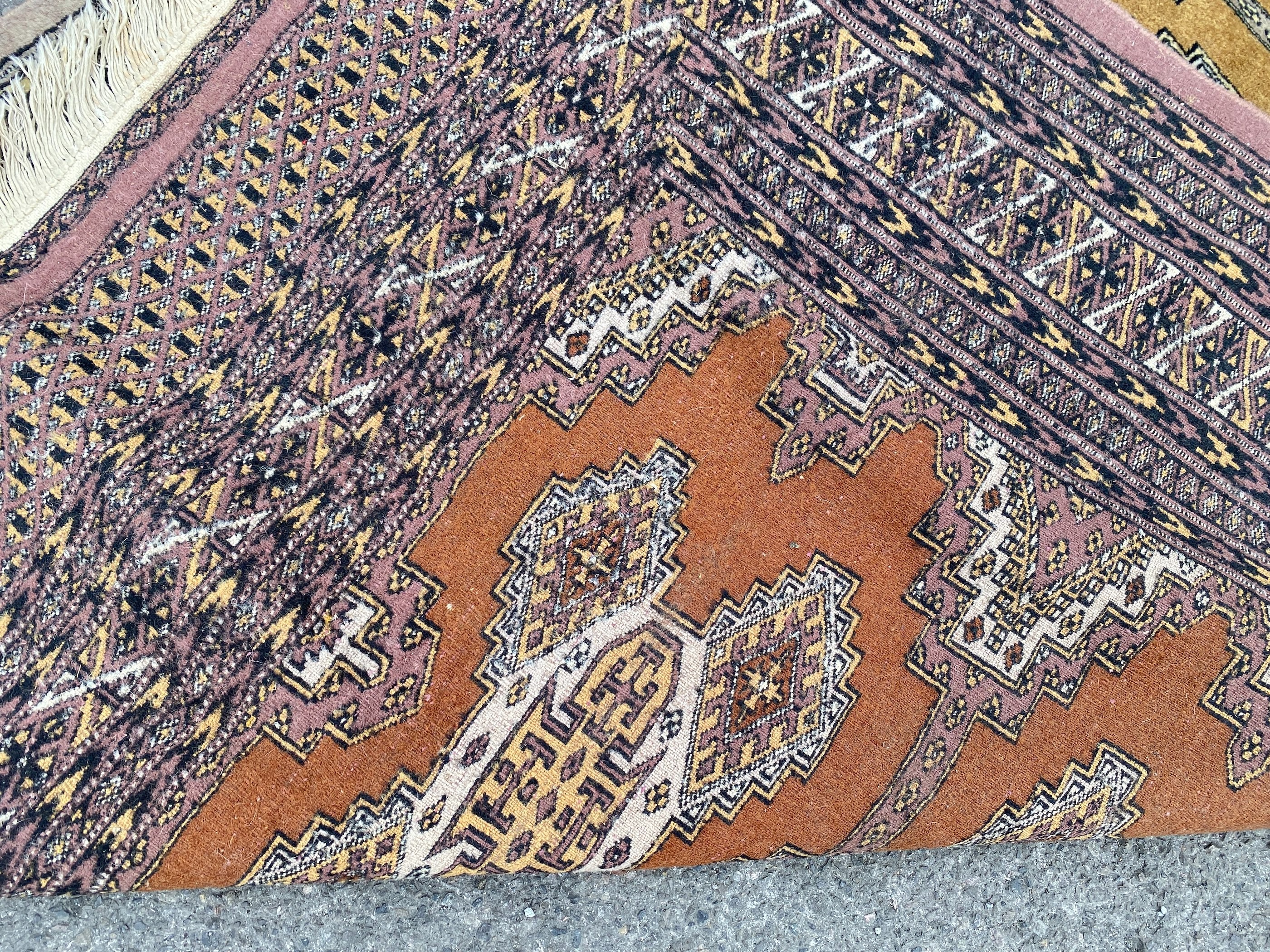 A Bokhara gold ground rug, 190 x 136cm